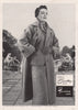 It's a Countess suit and Traveluxe Coat. Fashion advert. BRITISH VOGUE 1955
