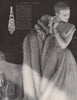Matching fur & fabric. Pale grey Platina fox stole. Fashion. BRITISH VOGUE 1955