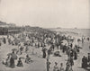 The beach in Atlantic City, New Jersey. Many people. Parasols 1895 old print