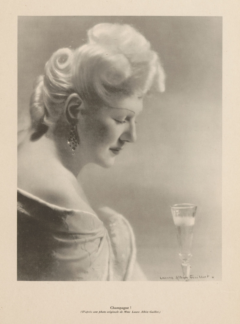 Champagne! Drinking Champagne from a flute. Laure Albin-Guillot 1944 old print